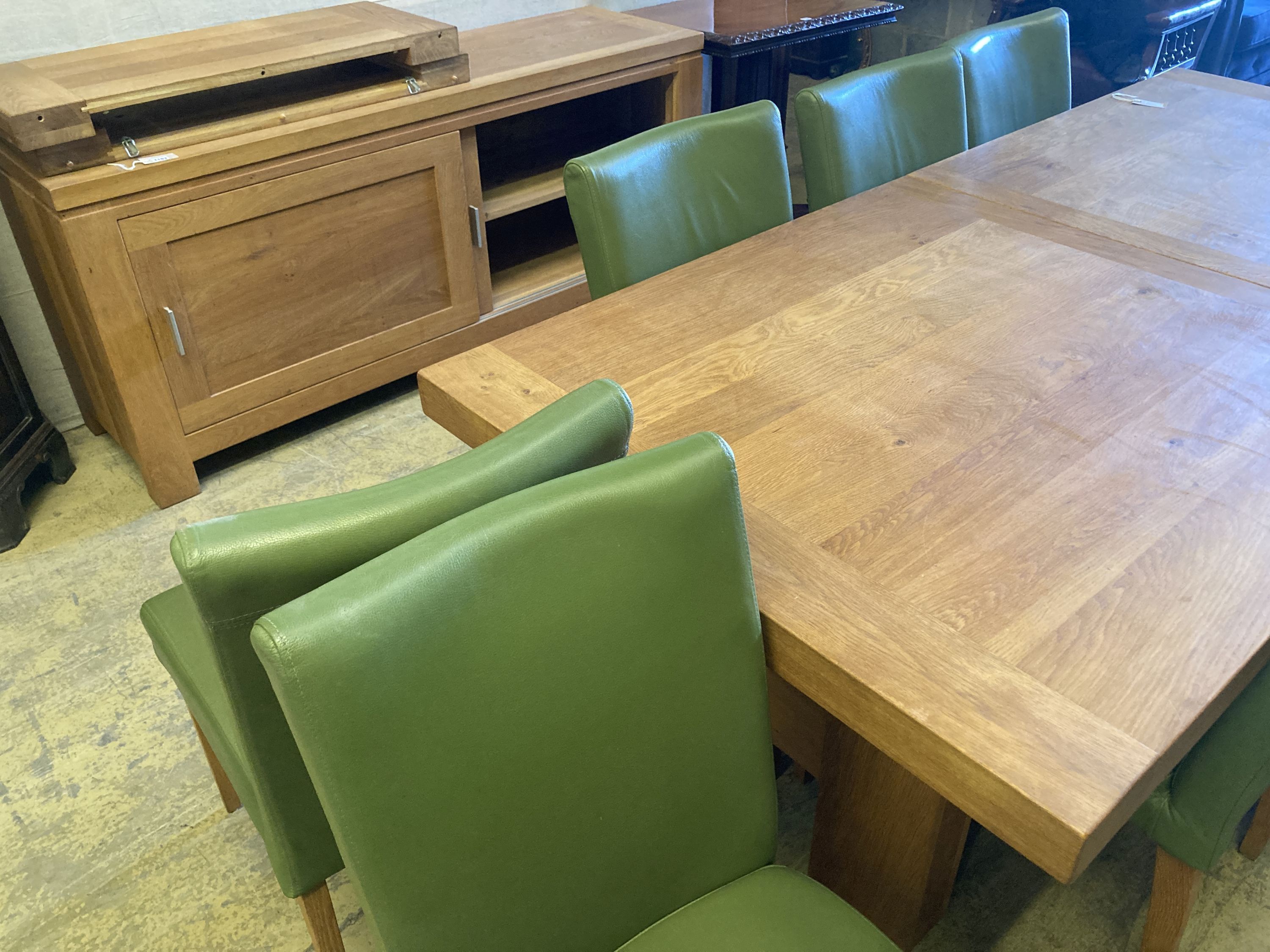 A contemporary oak dining suite,